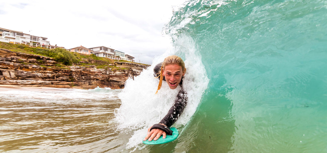 bodysurfer surfing a handplane 