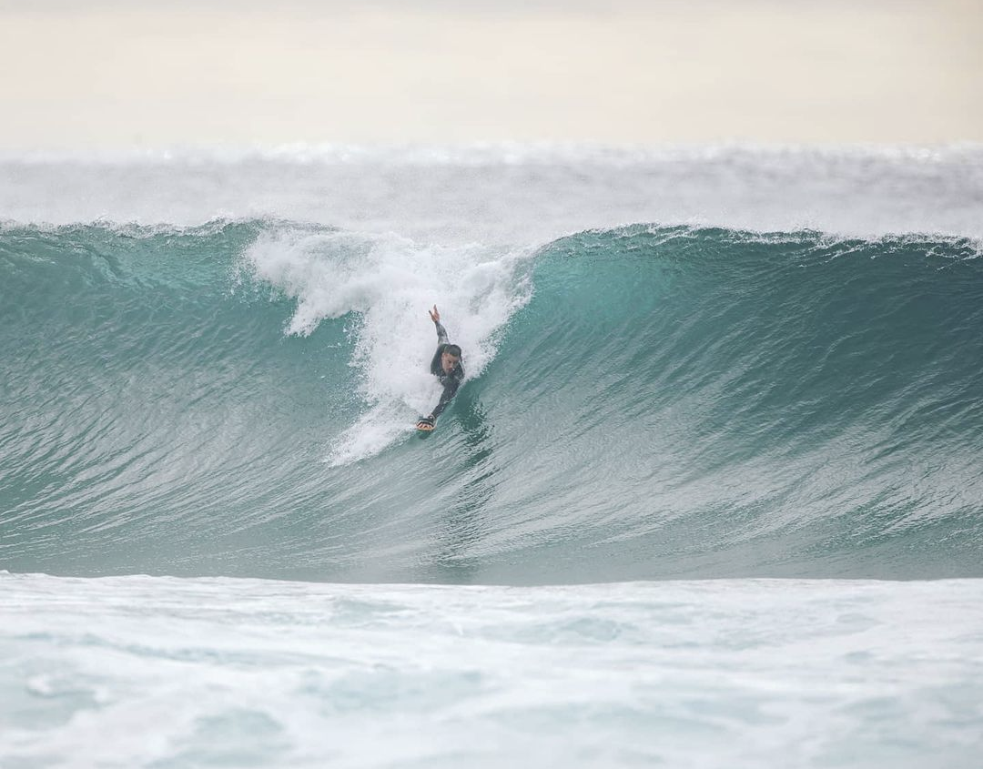 body surfer surfing a wave